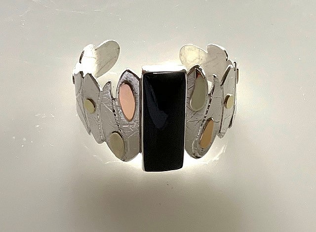 Elyse Bogart, #401 CUFF BRACELET WITH BLACK JADE
Sterling Silver, 14k Pink, Green, and Yellow Golds, Edwards Black Jade
EBOG#401
$950
Free Domestic Shipping